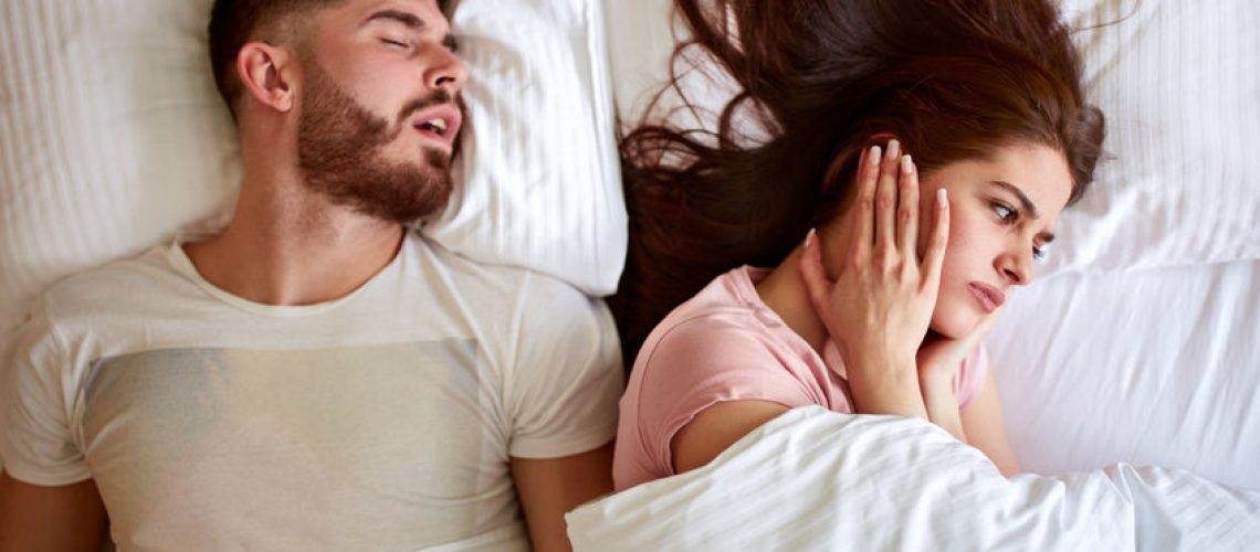 Young couple have problem with man's snoring